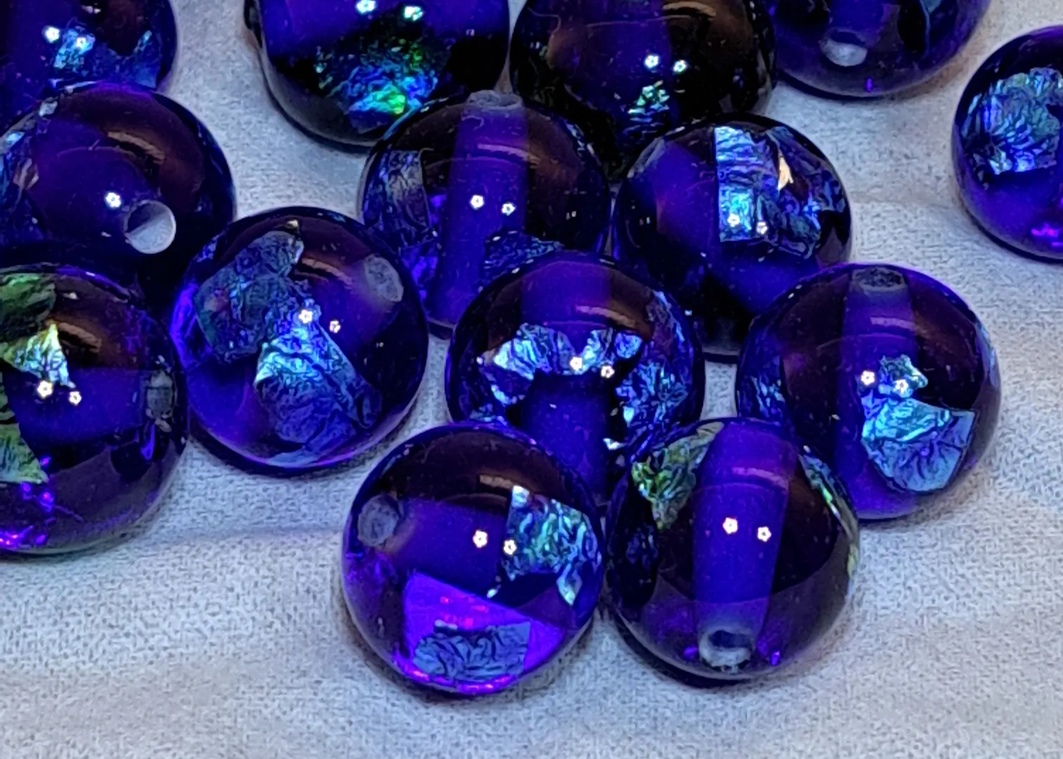 Blue glass bead of the universe