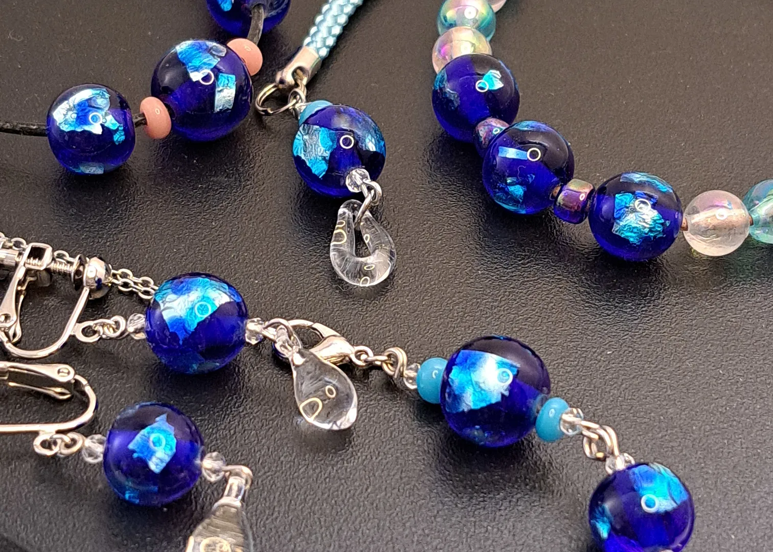 Creating accessories with space blue patterned glass beads.